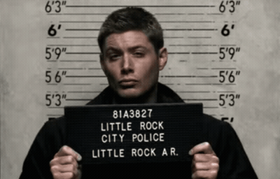 Man Holding Rock City Police Mugshot GIF
