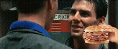 Man Holding Sandwich In Front Of Eric Sign GIF