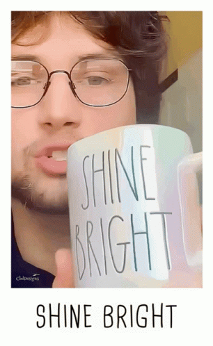 Man Holding Shine Bright Mug GIF