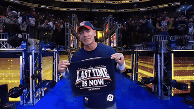 Man Holding Shirt Saying Last Time Is Now GIF