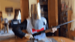 Man Holding Shotgun Firmly GIF