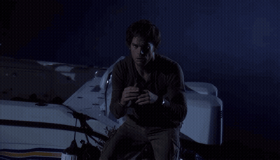 Man Holding Shovel Next To RIP Grave GIF