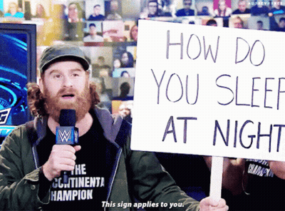 Man Holding Sign How Do You Sleep At Night GIF