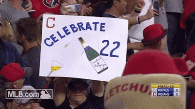 Man Holding Sign Saying Celebrate 22 GIF