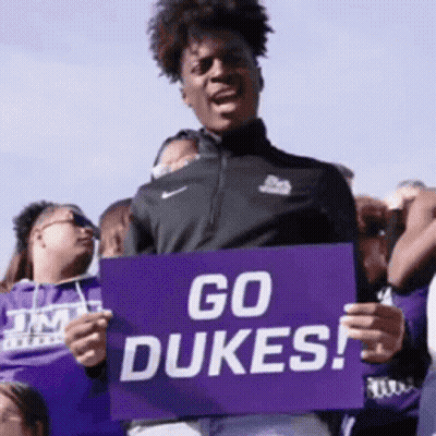 Man Holding Sign Saying Go Dukes GIF