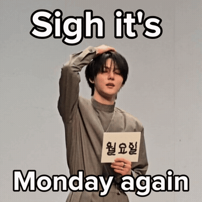Man Holding Sign Saying Sigh It's Monday Again