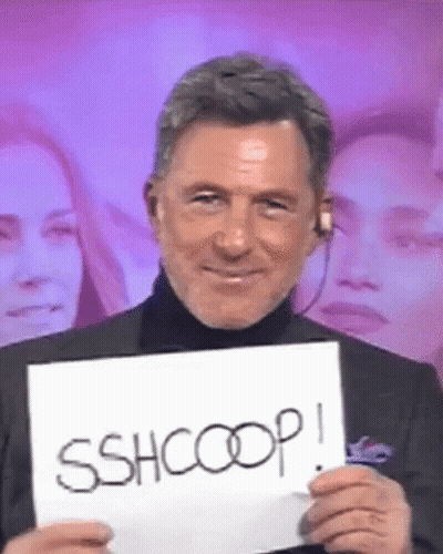 Man Holding Sign Saying Sshcoop GIF