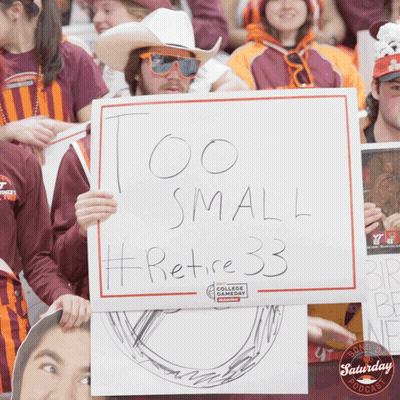 Man Holding Sign Saying Too Small Retire 33 GIF