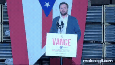 Man Holding Sign Saying Vance At Microphone GIF