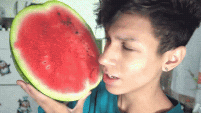 Man Holding Slice of Watermelon