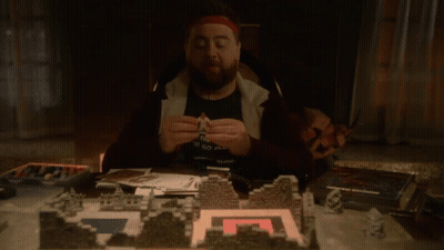 Man Holding Small Figurine GIF