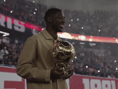 Man Holding Soccer Ball In Front Of Paris Sign GIF