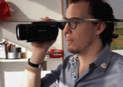 Man Holding Sony Camera GIF