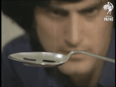 Man Holding Spoon In Front Of Face Saying Pathe GIF