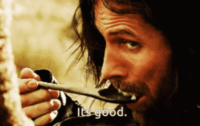 Man Holding Spoon In Mouth Saying It's Good GIF