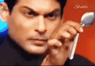 Man Holding Spoon With Shubhs