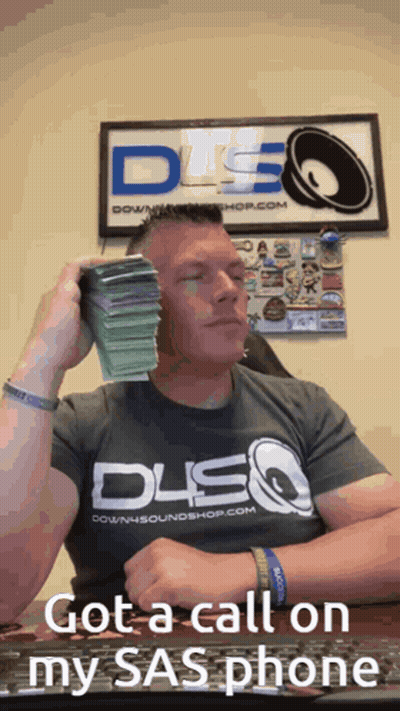 Man Holding Stack Of Money By DSQ Sign GIF