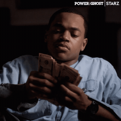 Man Holding Stack Of Money In Front Of Power Ghost Starz Banner GIF