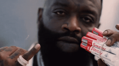 Man Holding Stack of Saucy Sauce