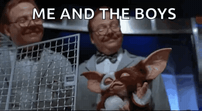 Man Holding Stuffed Animal In Cage While Another Holds Fence GIF