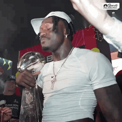 Man Holding Super Bowl Champions Trophy GIF