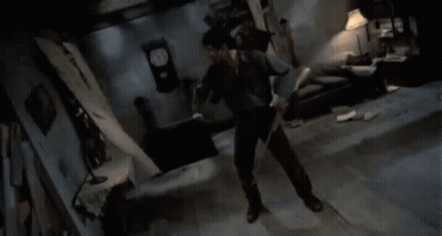 Man Holding Sword In Dark Room GIF