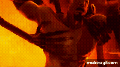 Man Holding Sword In Front Of Fire Says Make A GIF