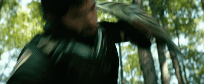 Man Holding Sword In Woods GIF