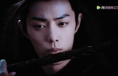 Man Holding Sword With Chinese Writing GIF