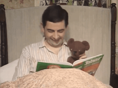 Man Holding Teddy Bear Reading Asterion GIF