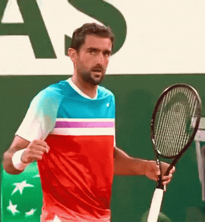 Man Holding Tennis Racquet At Sign Saying As GIF