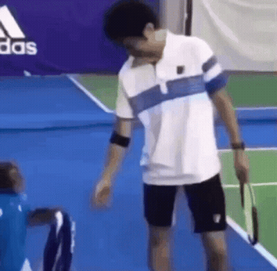 Man Holding Tennis Racquet GIF
