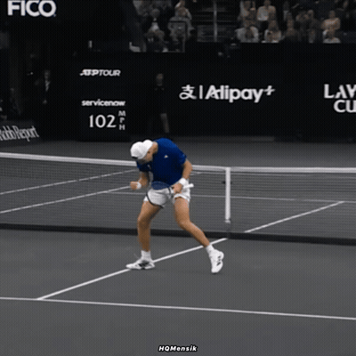 Man Holding Tennis Racquet In Front Of 102 Mph Sign GIF