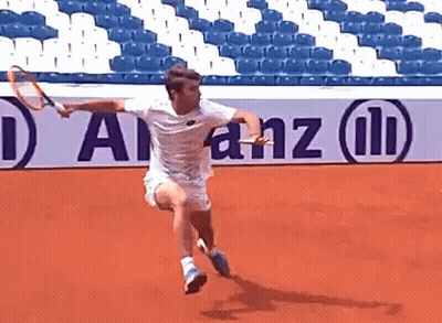 Man Holding Tennis Racquet In Front Of Allianz Sign GIF