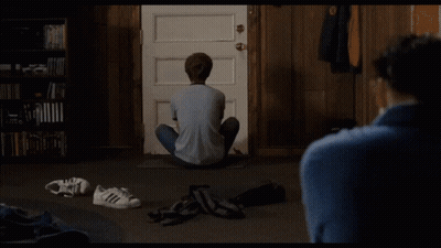 Man Holding Tennis Racquet In Front Of Crowd GIF