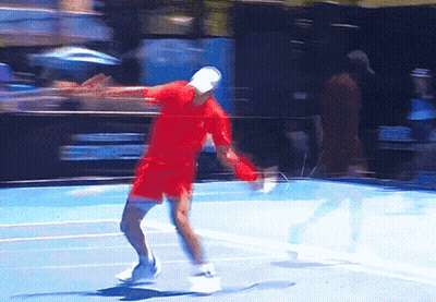 Man Holding Tennis Racquet In Front Of Emirates Ad GIF