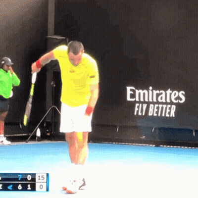 Man Holding Tennis Racquet In Front Of Emirates Fly Better Sign GIF