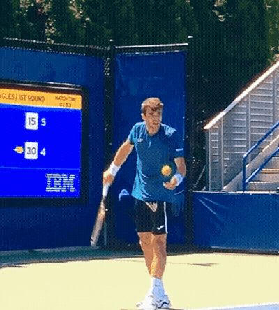Man Holding Tennis Racquet In Front Of IBM Scoreboard GIF
