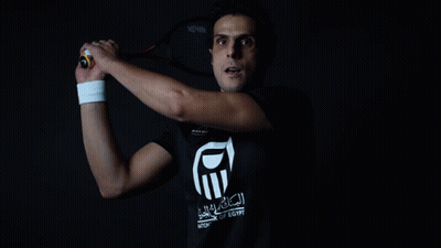 Man Holding Tennis Racquet In National Of Egypt Shirt GIF