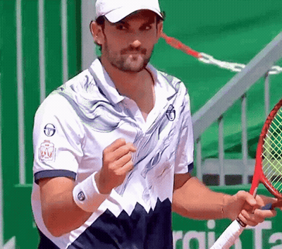 Man Holding Tennis Racquet Near Allianz Sign GIF