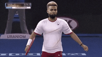 Man Holding Tennis Racquet Near Uranium Sign GIF