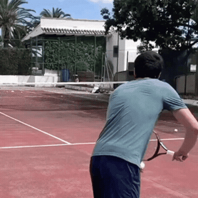 Man Holding Tennis Racquet On Court GIF