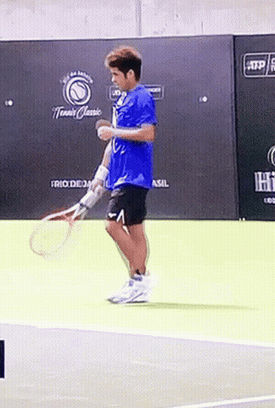 Man Holding Tennis Racquet On Court GIF