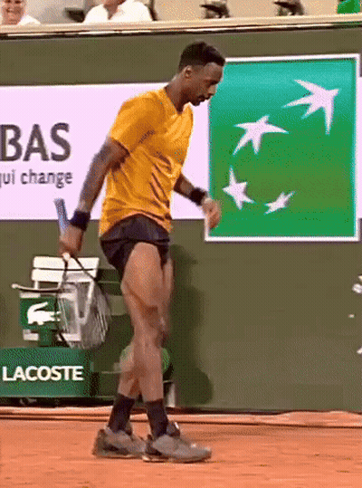 Man Holding Tennis Racquet On Court GIF