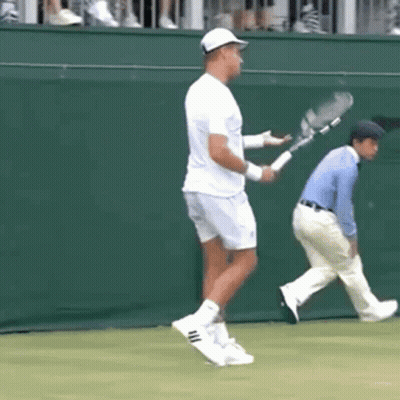Man Holding Tennis Racquet On Court GIF