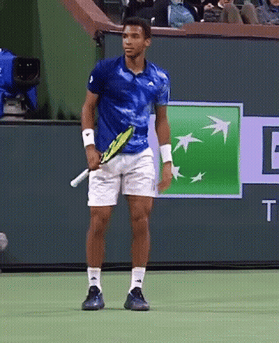 Man Holding Tennis Racquet On Court With BNP Logo GIF