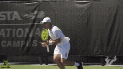 Man Holding Tennis Racquet On Court With Bullpen Logo GIF