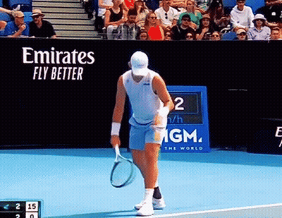 Man Holding Tennis Racquet On Court With Emirates Fly Better Banner GIF