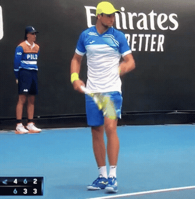 Man Holding Tennis Racquet On Tennis Court With Emirates Better Sign GIF