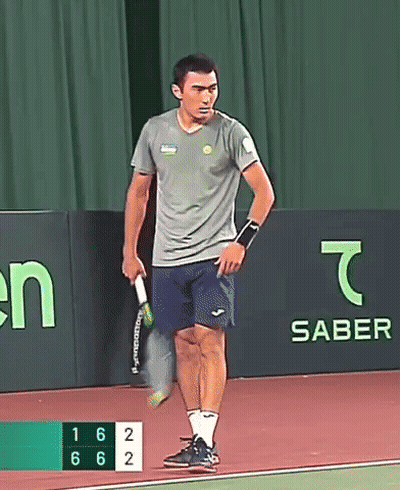 Man Holding Tennis Racquet With Saber Banner GIF